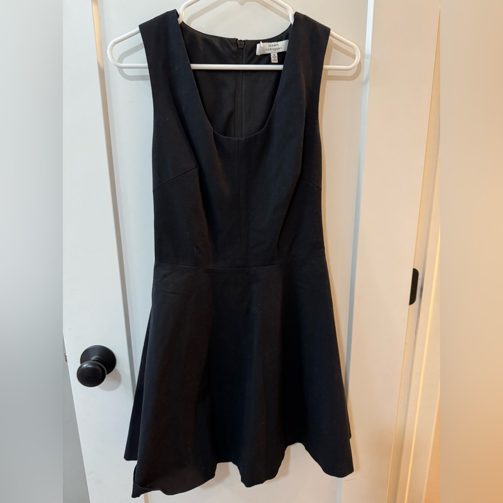 Cute black dress with leather back by Robert Rodriguez